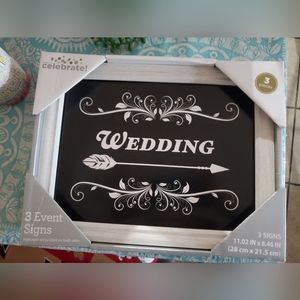 Three wedding signs.